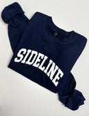 Navy blue cozy crewneck sweater with logo from Sideline Bags.