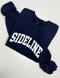 Navy blue cozy crewneck sweater with logo from Sideline Bags.