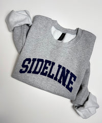 Gray cozy crewneck sweater with logo from Sideline Bags.
