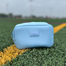 Carolina blue travel organizer pouch out on the field from Sideline Bags.