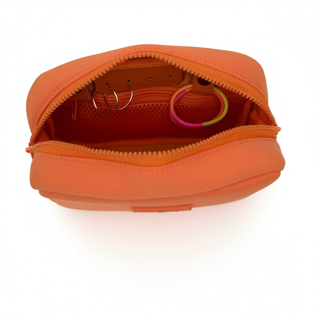 Orange travel organizer pouch from Sideline Bags featuring internal compartments.