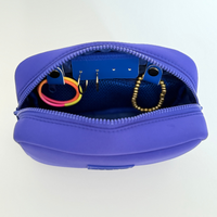 Royal blue travel organizer pouch with internal compartments from Sideline Bags.
